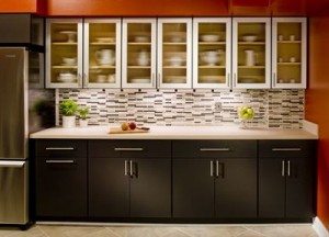 black lower kitchen cabinets with frost glass upper cabinets