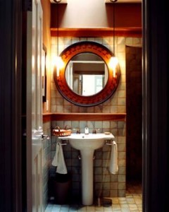 vintage bathroom with circle mirror