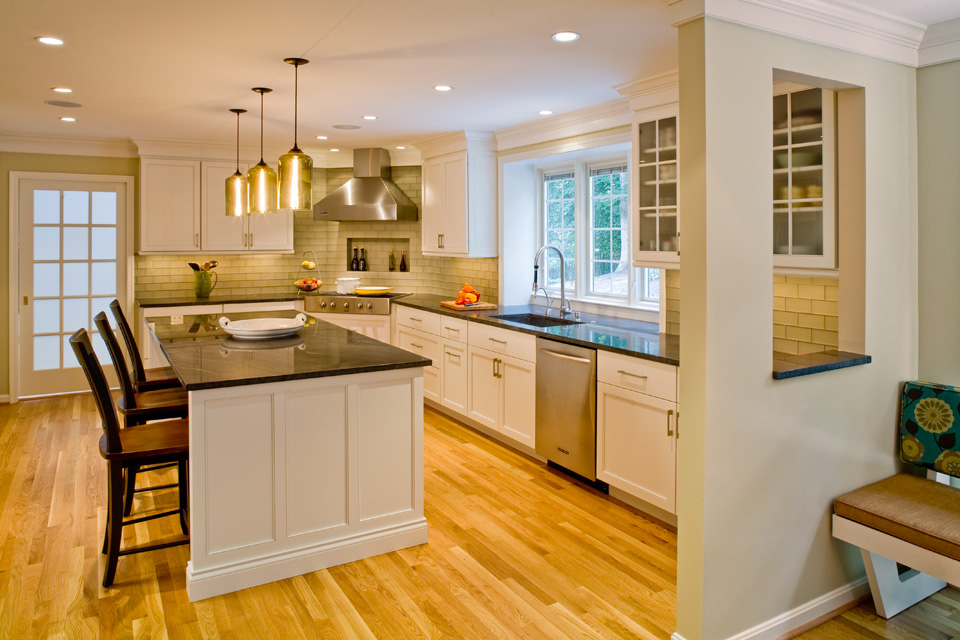 A transitional kitchen featuring stone countertops 
