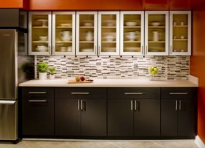 black lower kitchen cabinets with frost glass upper cabinets