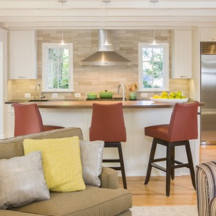 updated kitchen island with three red bar stools