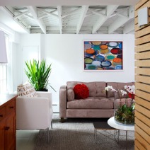 white and tan living area with bright red accents