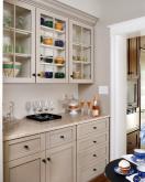 tan cabinets with glass upper cabinet doors