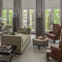 living room with modern sofa and accent chairs