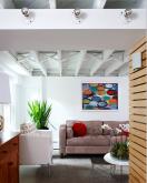 white living room with a light wood accent wall