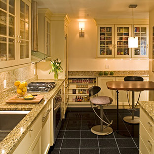 updated kitchen with custom white cabinets and tan granite countertops