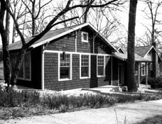 Black and white image of a one story house