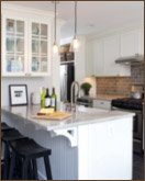 white kitchen island with black stools