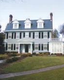 exterior home with grey siding and black shutters