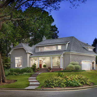 Gray house with path leading to frontdoor