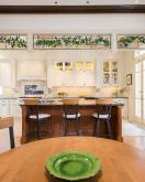 kitchen remodel with white cabinets and dark wood island