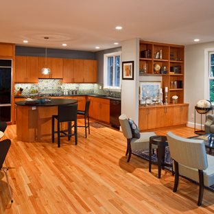 A recently remodeled kitchen in a DC home with warm wood cabinets and flooring