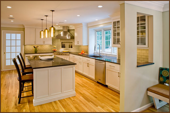 large kitchen with island and white cabinets