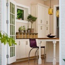 kitchen view an island and cusotm cabinets