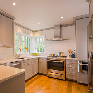 A newly remodeled kitchen with stainless steel appliances and bright windows