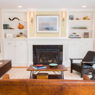 white custom built-ins around a fireplace