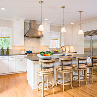 white kitchen cabinets and white tile backsplash