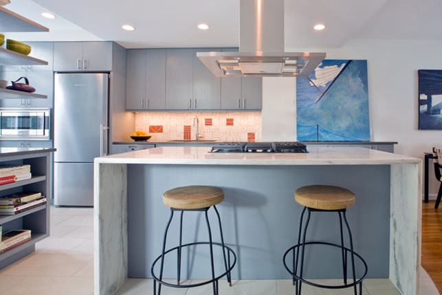 Kitchen remodel with island bar and seating with blue details