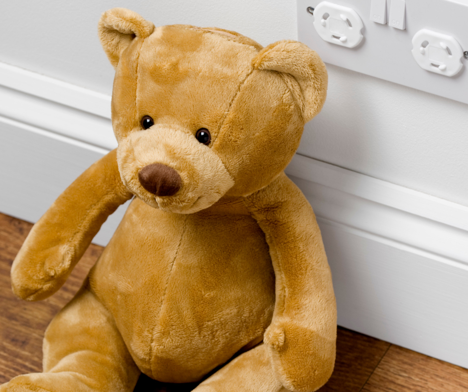 Childproofing outlets with a teddy bear 