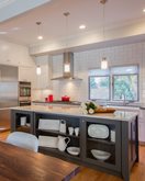 Recently remodeled kitchen in a DC home with an island with storage