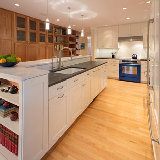 kitchen with white and natural wood custom cabinets