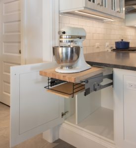 white kitchen cabinets with appliance slide out drawer