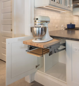 white kitchen cabinets with appliance slide out drawer