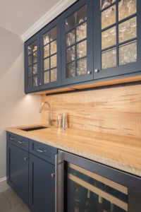 navy blue cabinets with glass upper cabinets