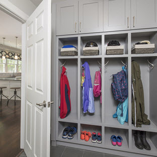 Mudroom with jackets, shoes, and baskets