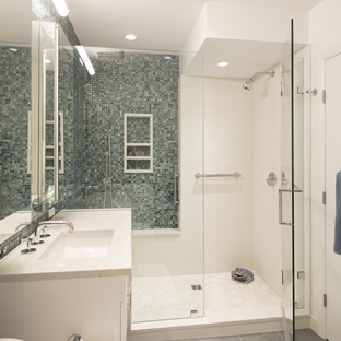 white bathroom with blue accent tile