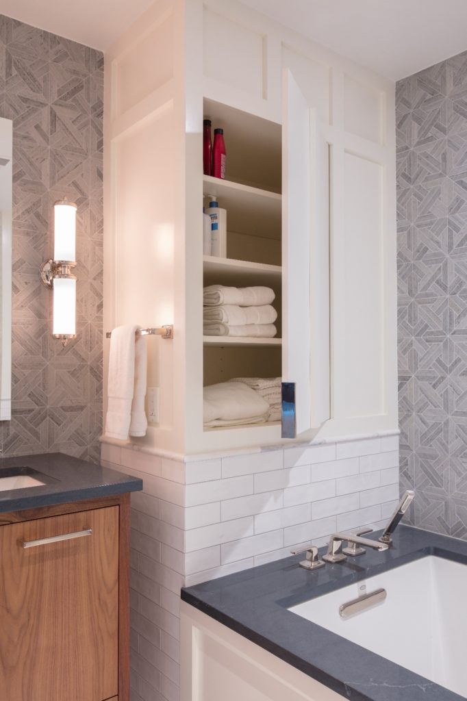 Remodeled bathroom with built-in shelving in DC