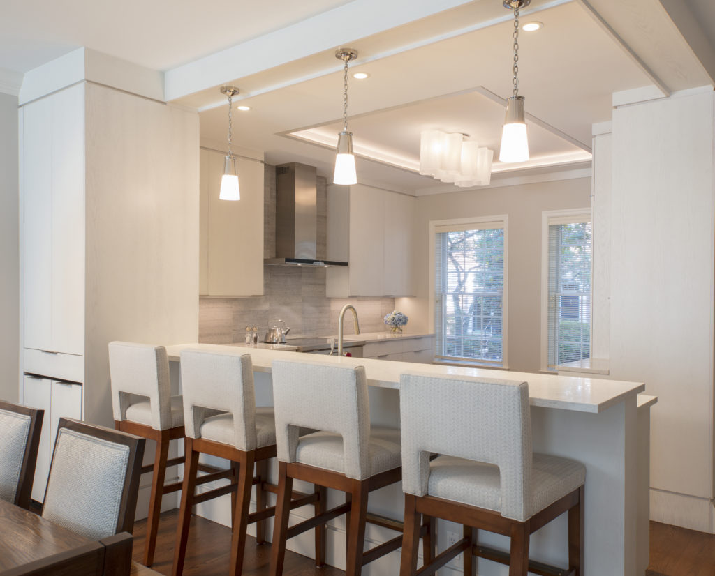 Remodeled kitchen in DC area with barstool seating and pendant lights