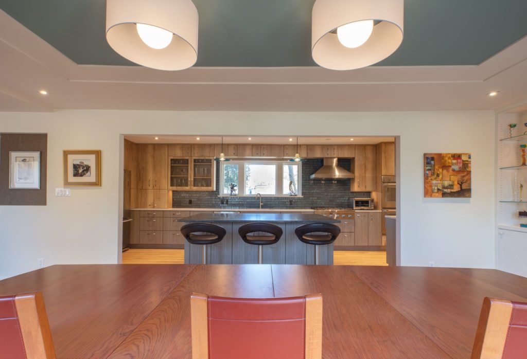 kitchen view with two black leather barstools