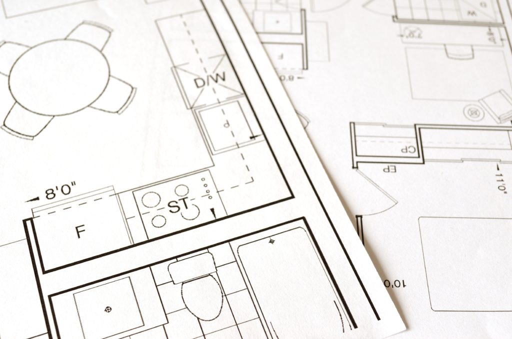 Close up of remodeling architect plans on table.