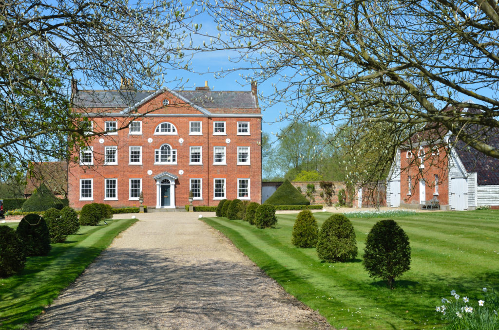 Front View of large Georgian Mansion with Drive