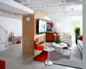 a living room filled with furniture and a flat screen tv