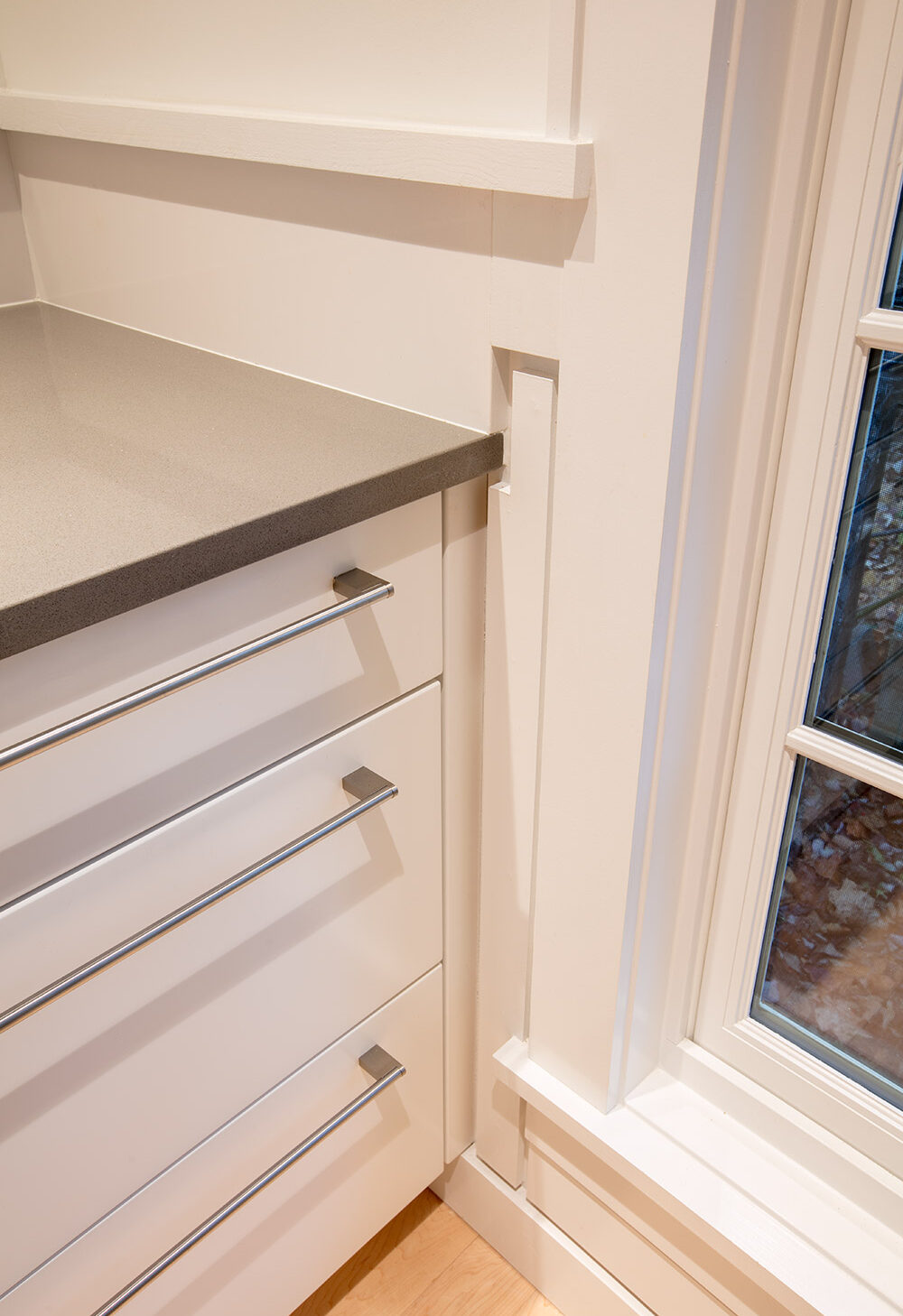 up close of modern kitchen drawers with brushed silver hardware