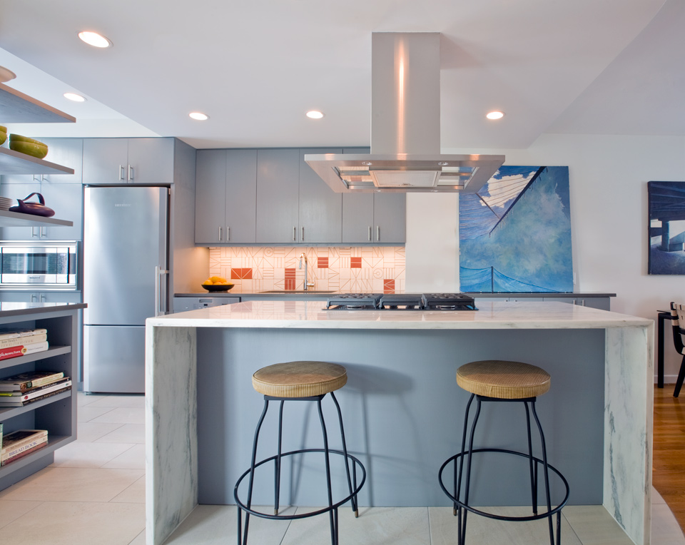 modern kitchen with powder blue cabinets and white marble countertops